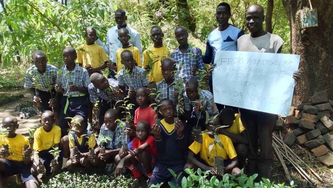 children with tree seedlings